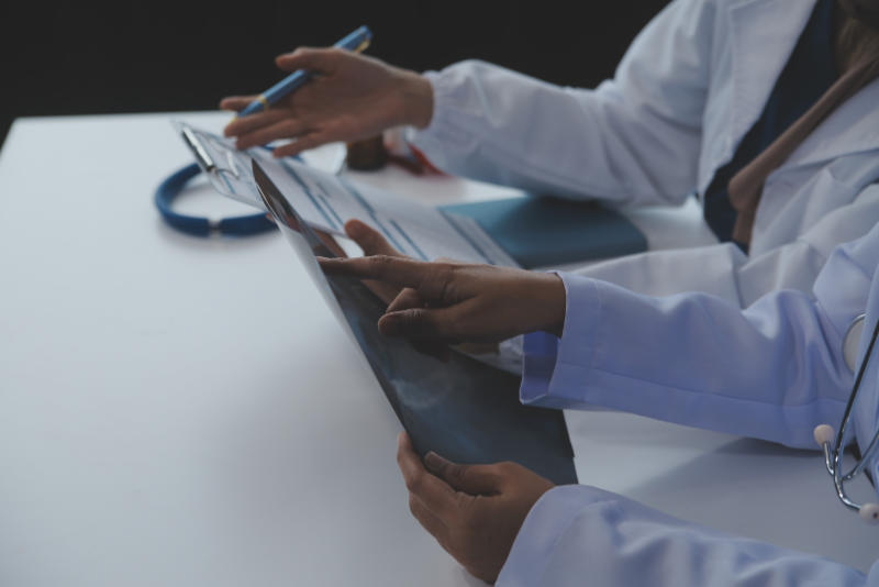 Doctor discussing diagnosis during the meeting. Group of doctor